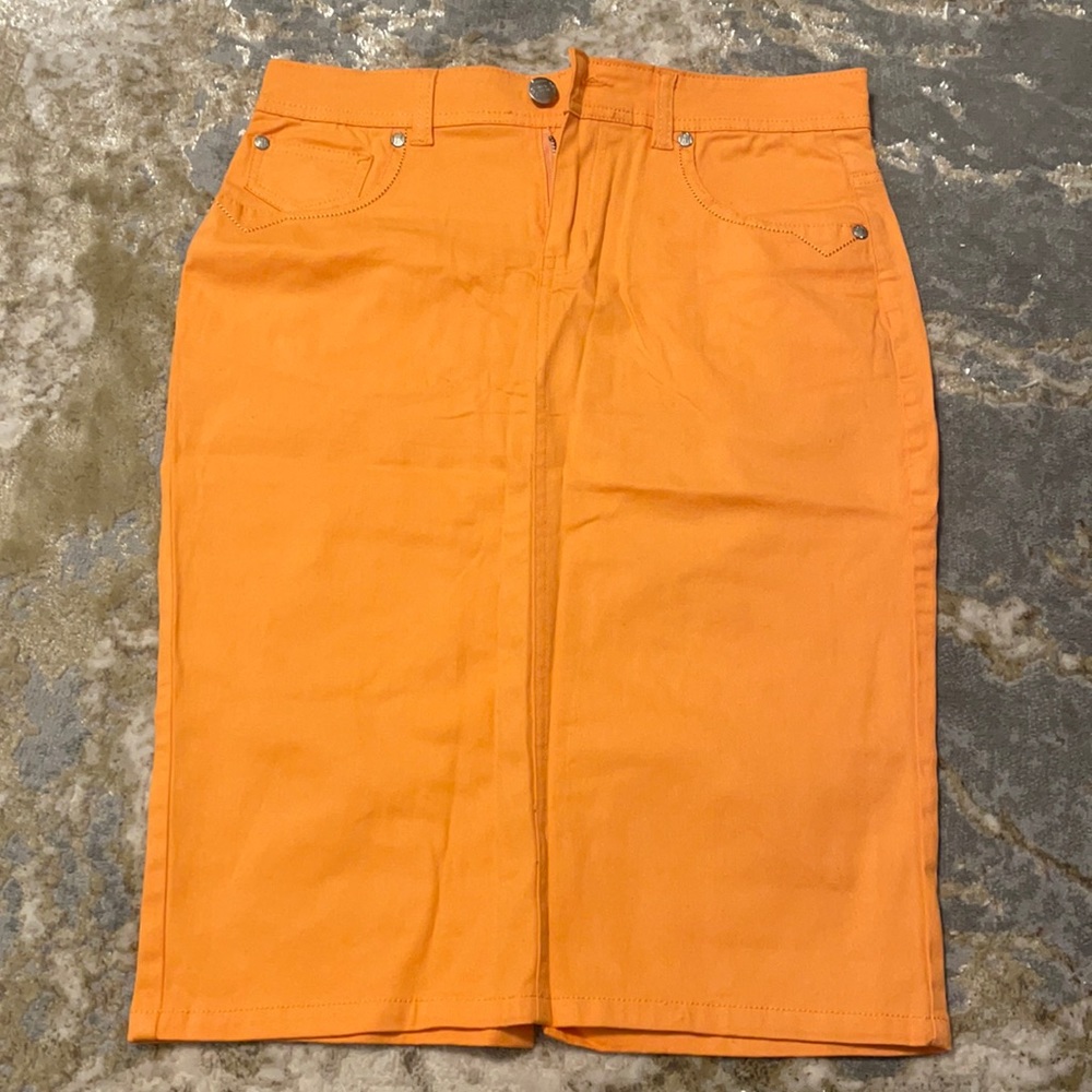 Brand New orange pencil skirt with slit in the back.
